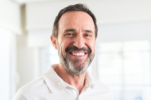 Man Smiling Widely After Gettting Single Implant Tooth Replacement in Wesley Chapel Florida