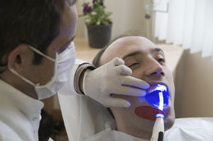 Wesley Chapel Florida Dentist Using VELscope To For Oral Cancer Screening
