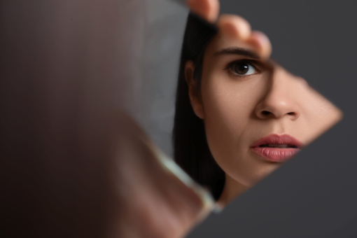 Lady in Wesley Chapel FL Thinking of Getting Dermal Fillers While Looking at Mirror